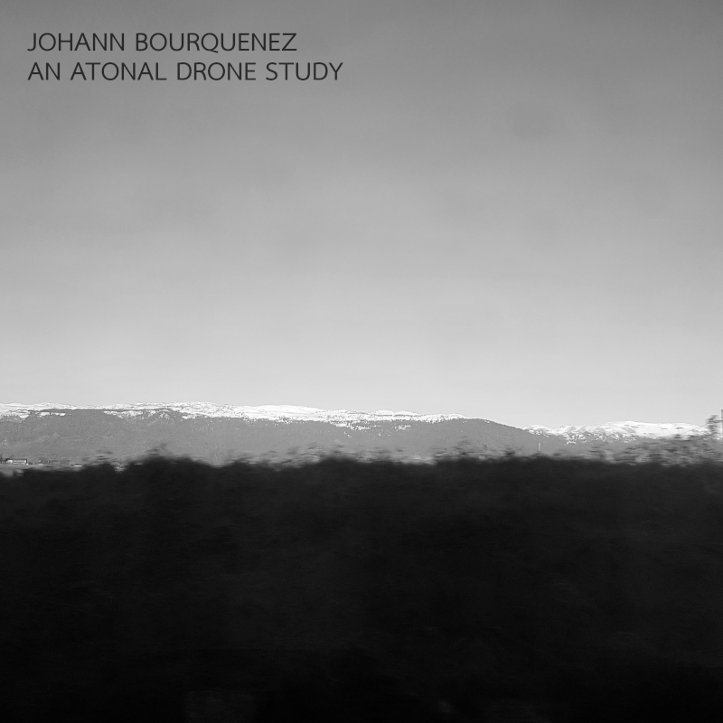 An Atonal Drone Study - black and white photo, the Jura mountain covered by snow, from the train