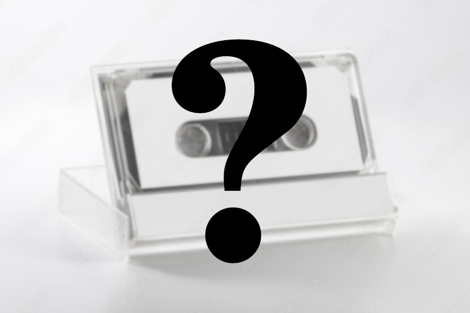 a white cassette in its box with a big black question mark in front
